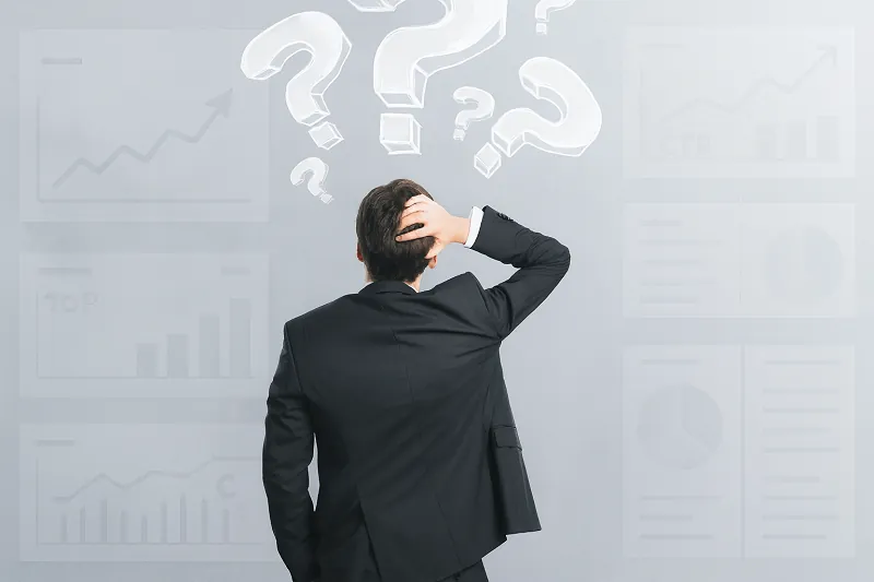 A man in a suit scratching his head while facing faint digital marketing dashboards with misleading positive metrics, surrounded by floating question marks to represent confusion about unclear performance data.