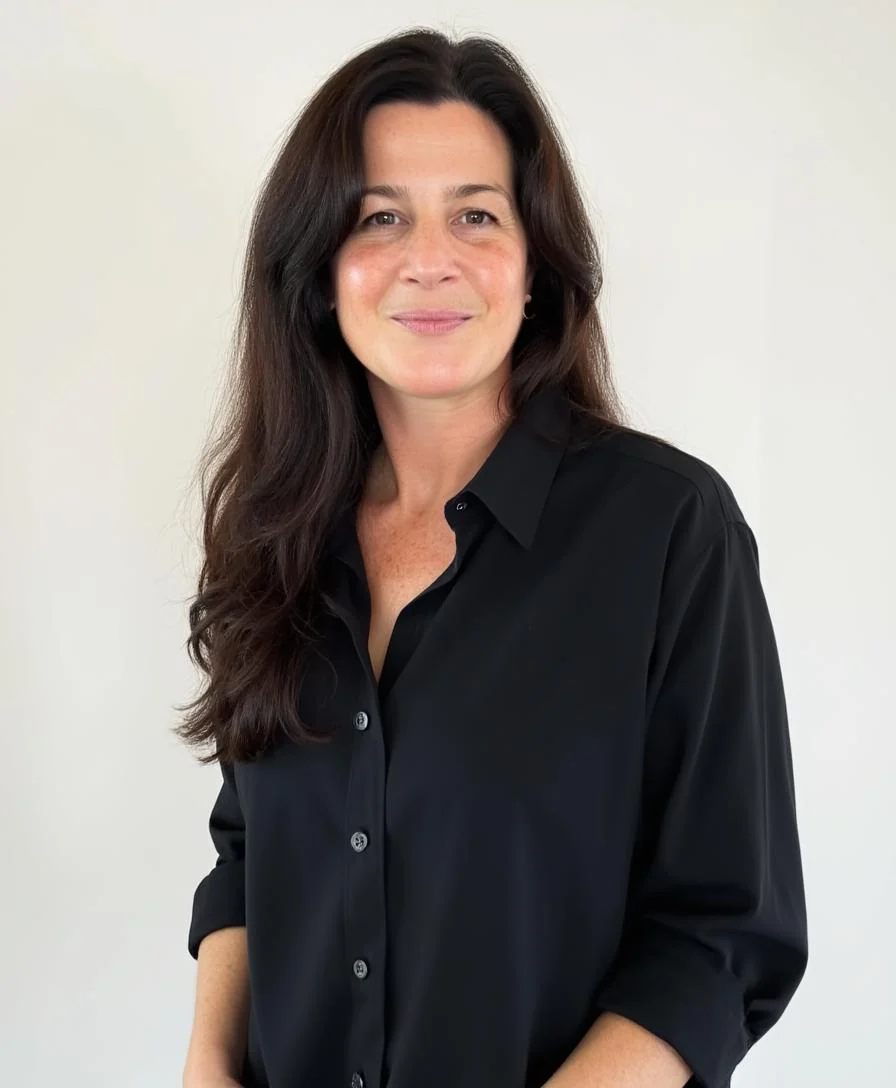 Jen Nickles, co-founder and CFO of JDS1 Marketing, smiling in a black button-down shirt